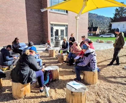 Staff sitting outside during a professional development activity